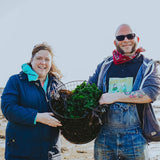 Ben & Naomi on the beach with a basket of fresh seaweed